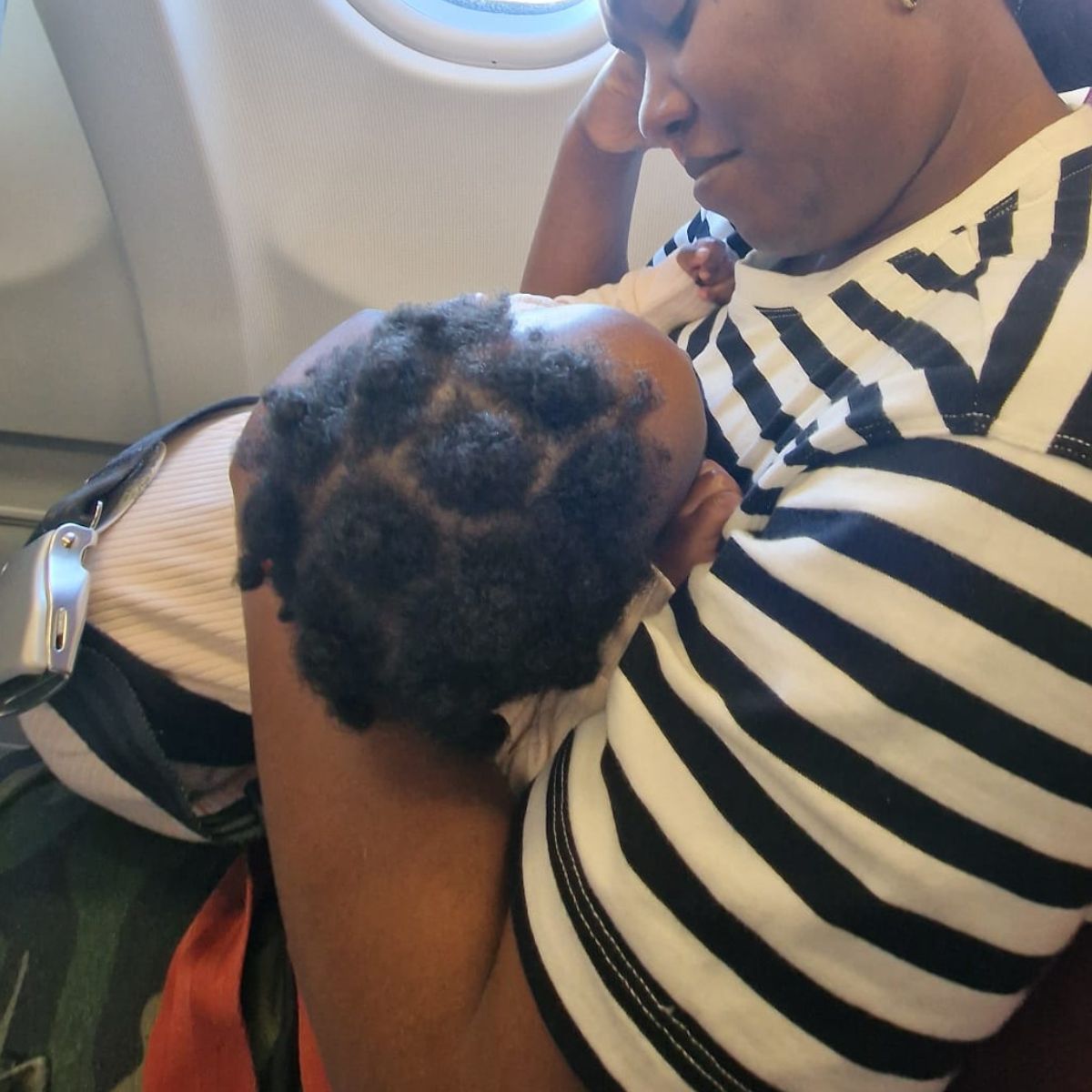 Mother with her baby on the plane